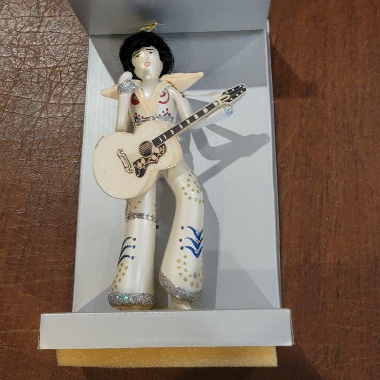 Vintage Elvis Presley in White Jumpsuit w/Guitar Blown Glass Christmas
Ornament. New, in original box. Please see the photos. It is
approximately 8