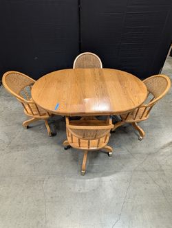 Set with Four Cane Back A-America Furniture Chairs with a Oval Wood Dining Table