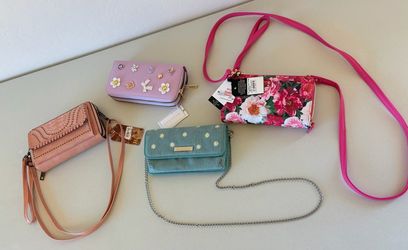* Four brand new clutch purse wallets. $20 takes all of them!