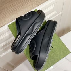 “Gucci Embossed Black Platform Slides”