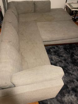 Grey sectional with ottoman