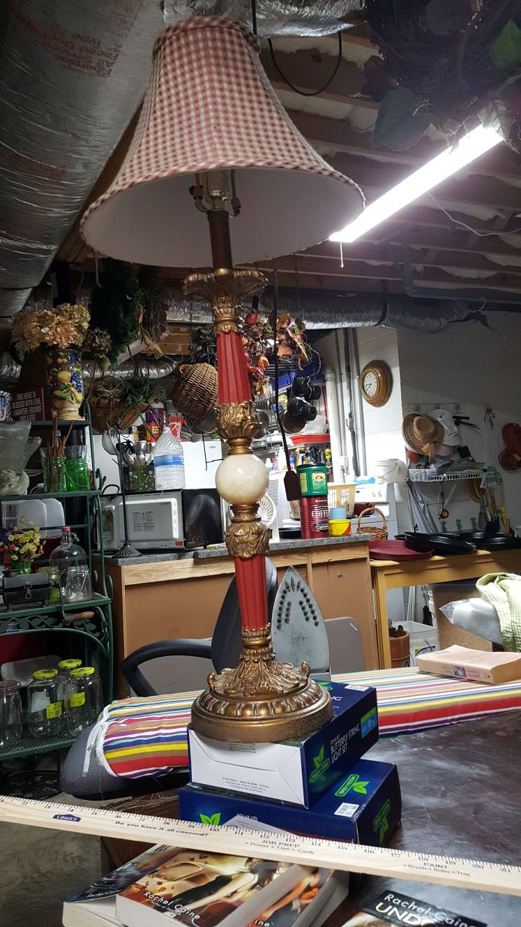 RED LAMP, CHECKED CLOTH SHADE, RED AND GOLD AT BASE, HEAVY AND EXPENSIVE, 33 INCHES TALL, WITH IVORY BALL IN MIDDLE OF BASE.