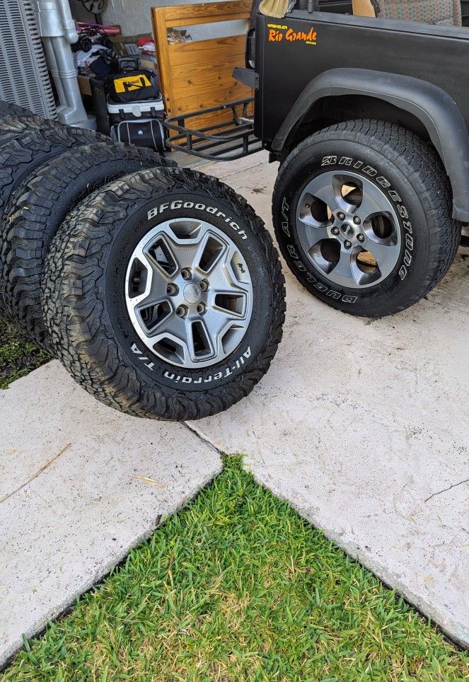 (5) OEM wheel from a Jeep Wrangler JK Rubicon
