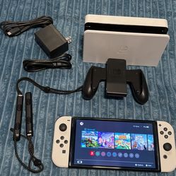 Nintendo switch oled with docking station, joycon grip and charger 