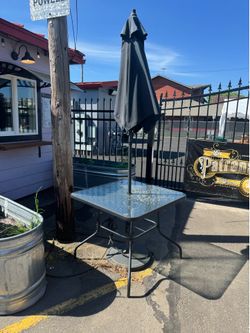 Patio table chairs umbrella and weighted pole