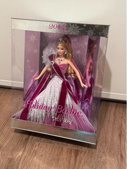 2005 Holiday Barbie designed by renowned fashion designer Bob Mackie.