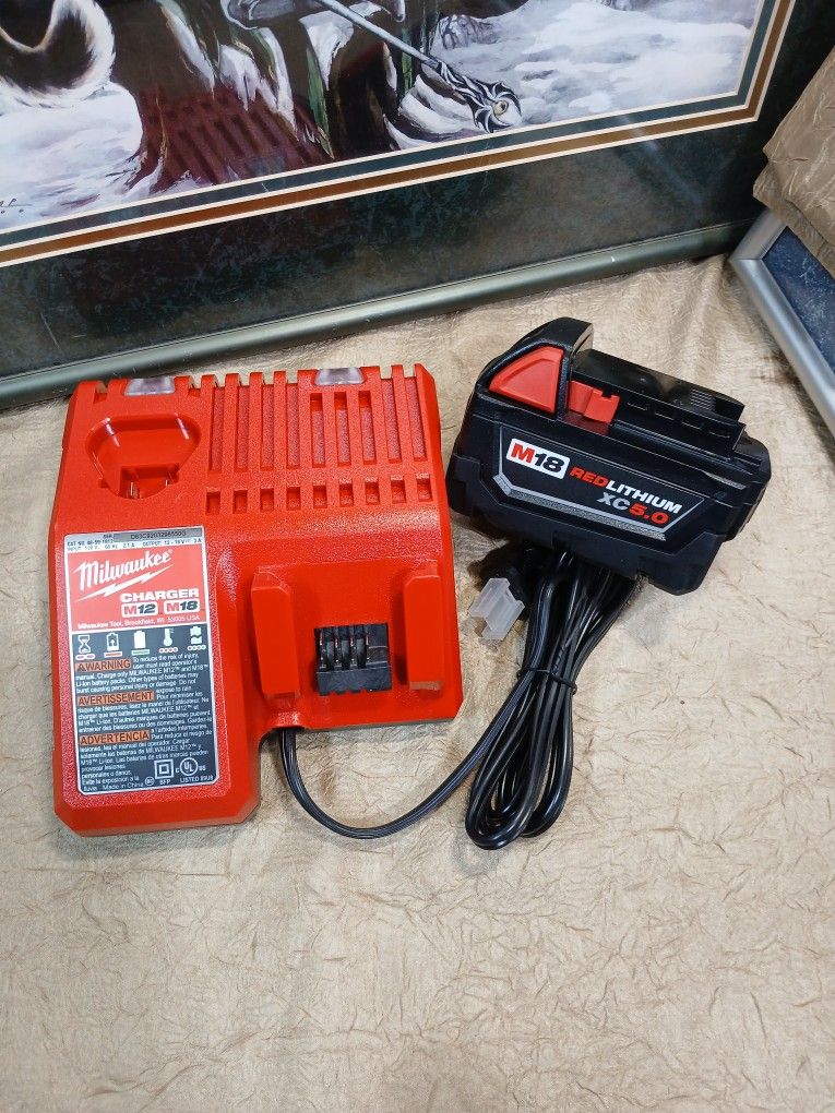 NEW MILWAUKEE M18 CHARGER AND BATTERY