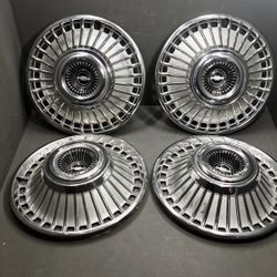 1(contact info removed) Chevy Hubcaps NOS