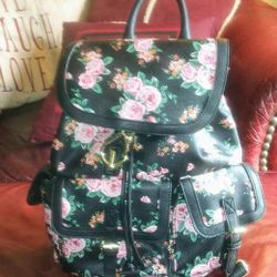 Black, Pink And Green Rose Printed Backpack With 4 Different Storage Pockets. Excellent Condition.