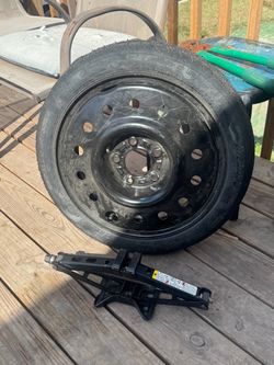 Chevy factory donut spare with jack