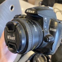 Nikon D5000 , Extra Portrait Lens. Tripod. Charger. Sling. 