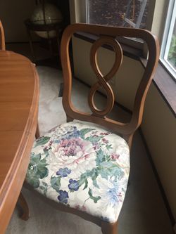 Table, four chairs, and three table leaves.