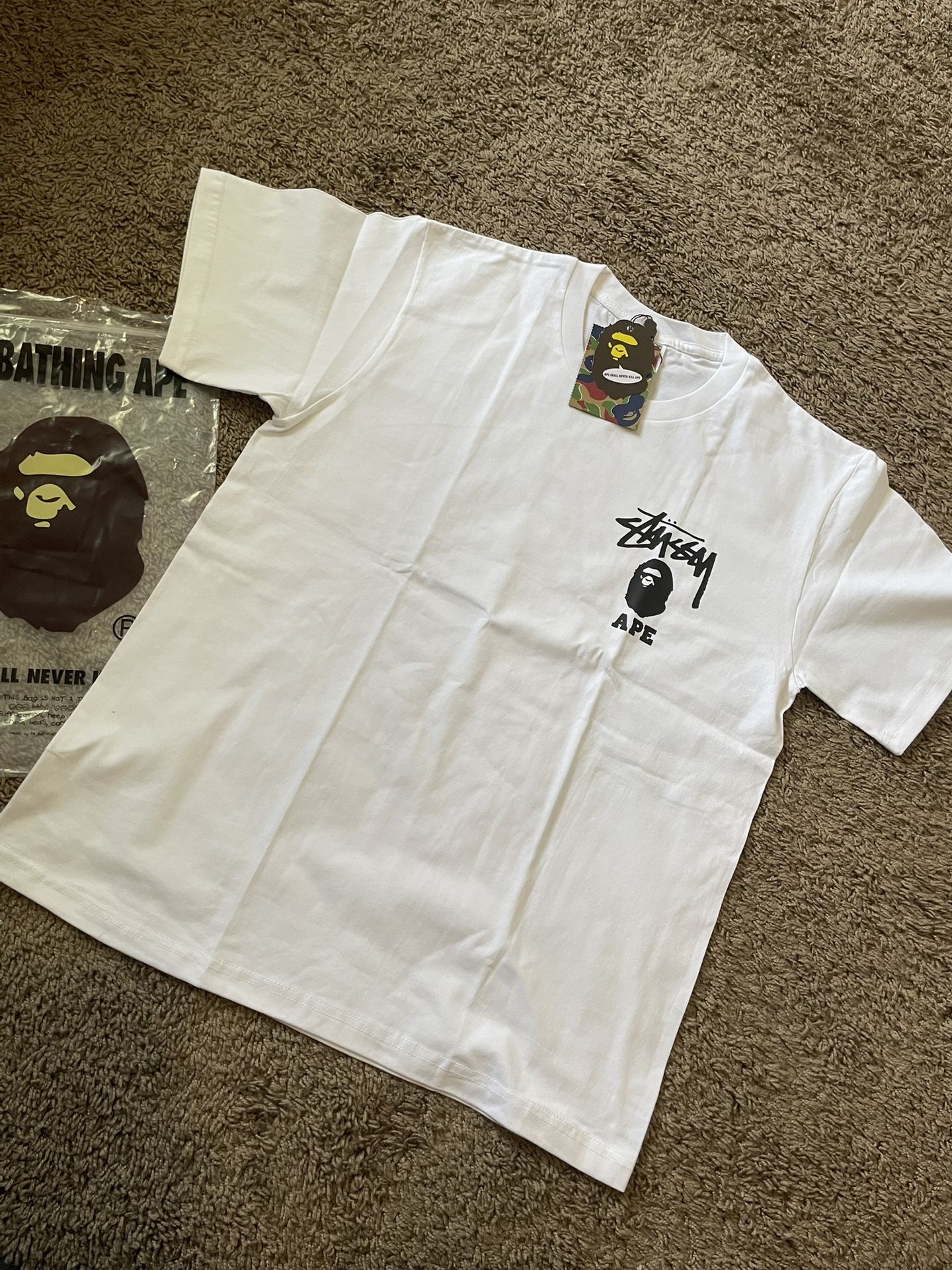 A Bathing ApeXStussy White Tshirt Size M