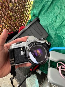 vintage Pentax ME Super 35mm SLR film camera equipped with an SMC Pentax-M 50mm f/2 standard prime lens