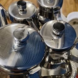 Silver Serving Platters, Stainless Steel Teapots, Butter knifes, Burgundy Napkins, Beer Pitchers Must Go