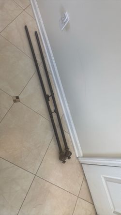 Long  window  curtain rod in brown color