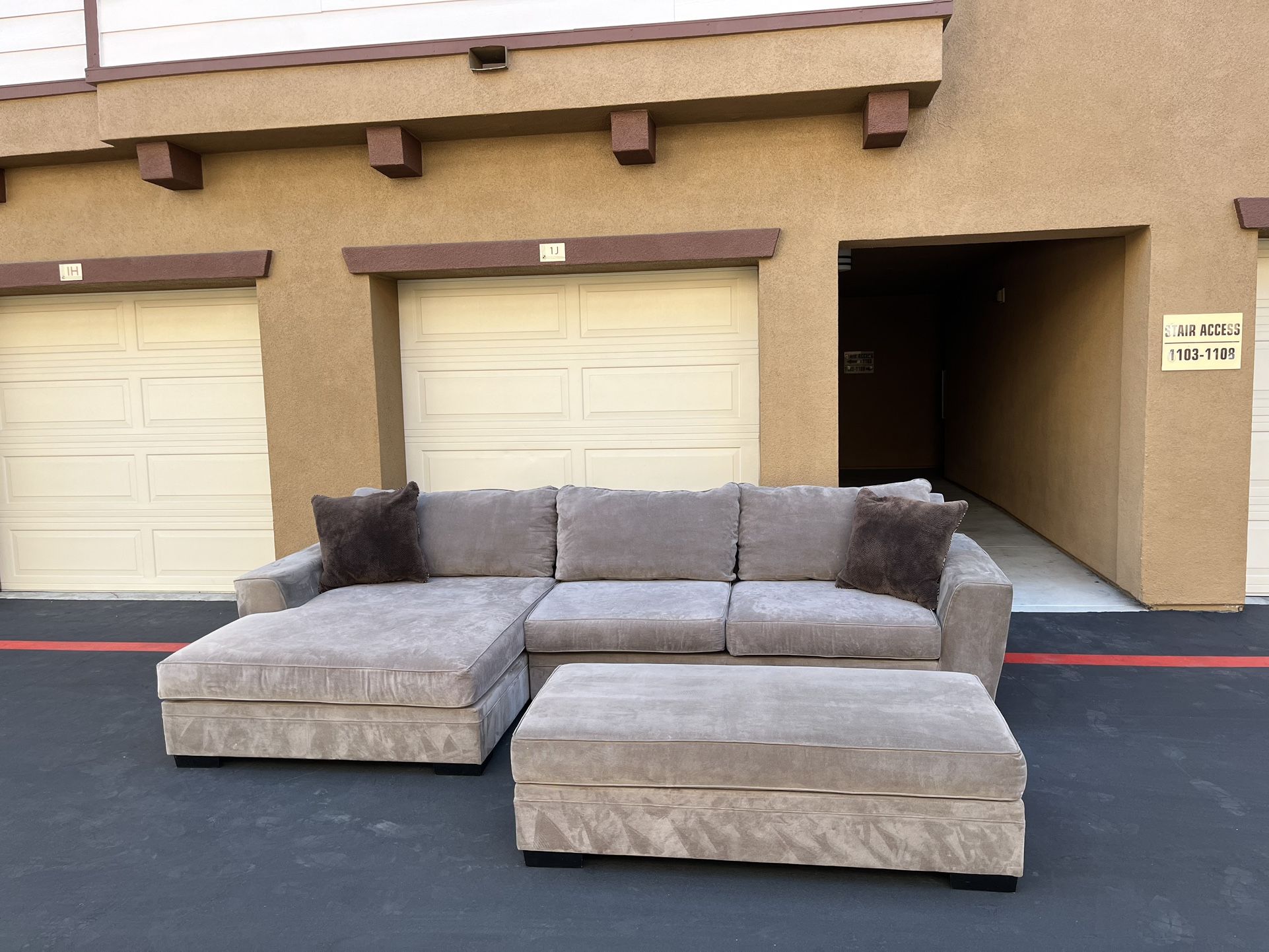 Living Spaces Gray Sectional Sofa + Ottoman – Clean & Spacious