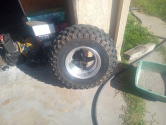 HONDA ATC 350 X FRONT WHEEL AND TIRE GREAT CONDITION 
