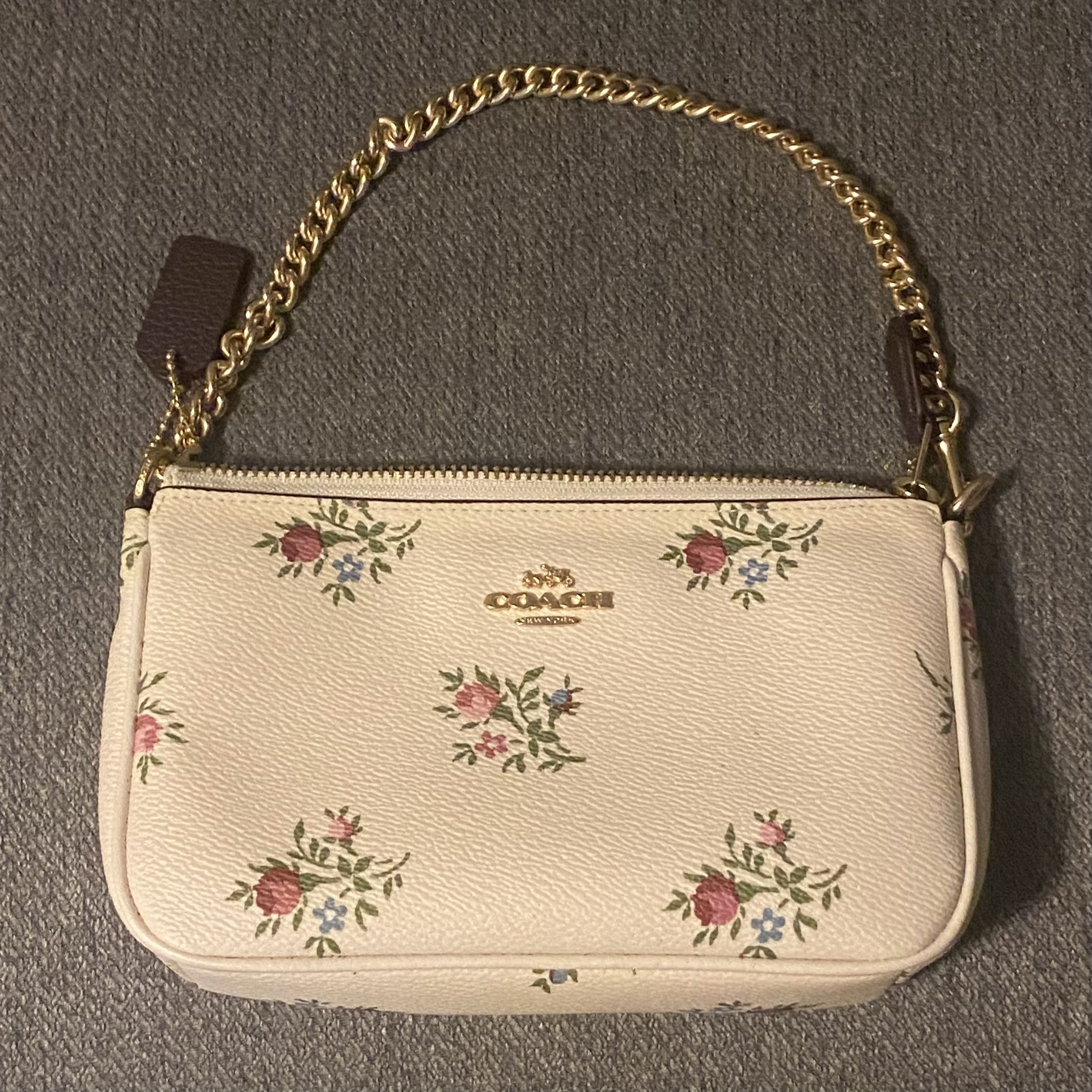Brand New & Authentic COACH Nokita Wristlet 19 With Cross Stich Floral Print Leather Handbag In Halk White With Chain Strap