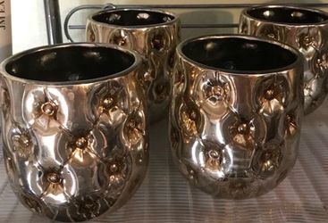 Variety of Silver and gold vases and candle holders