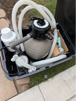 Sand pool filter and pump.