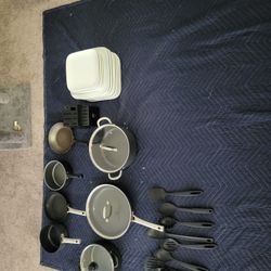 Pots Pans And Set Of Blowls And Plates 