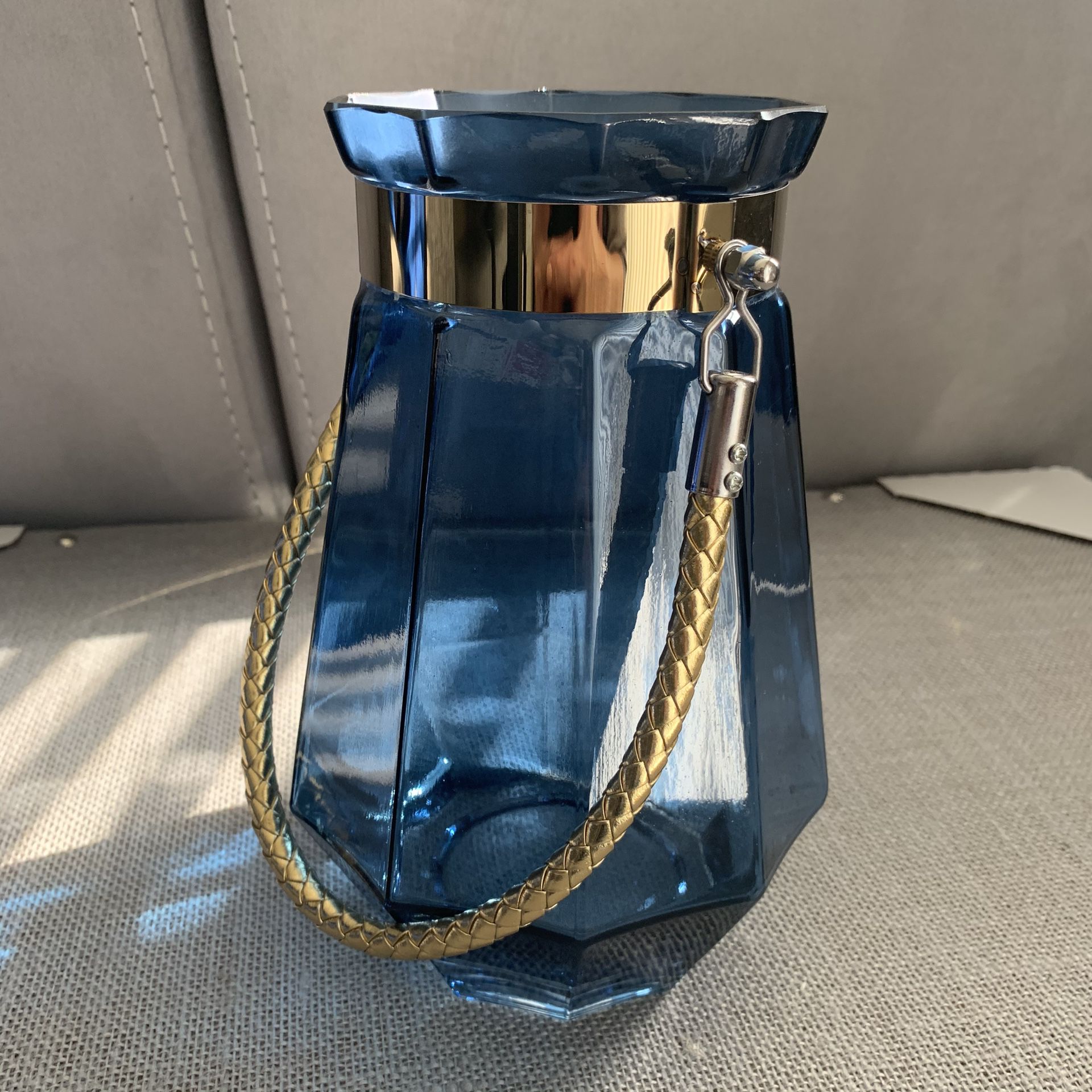 Glass flower vase, blue in gold tone handle
