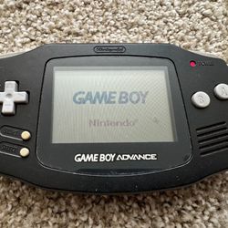 Nintendo GBA Game Boy Advance (AGB-001) - Black - Working good with a Tom and Jerry game cartridge.