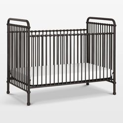 Metal crib with mattress if needed