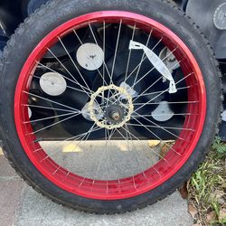 24” by 4” bicycle rims with new tires and disc brakes