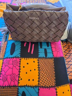 Brown women's handbag, Bebe brand, measures 12 x 8 inches