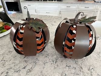Two metal decorative pumpkins