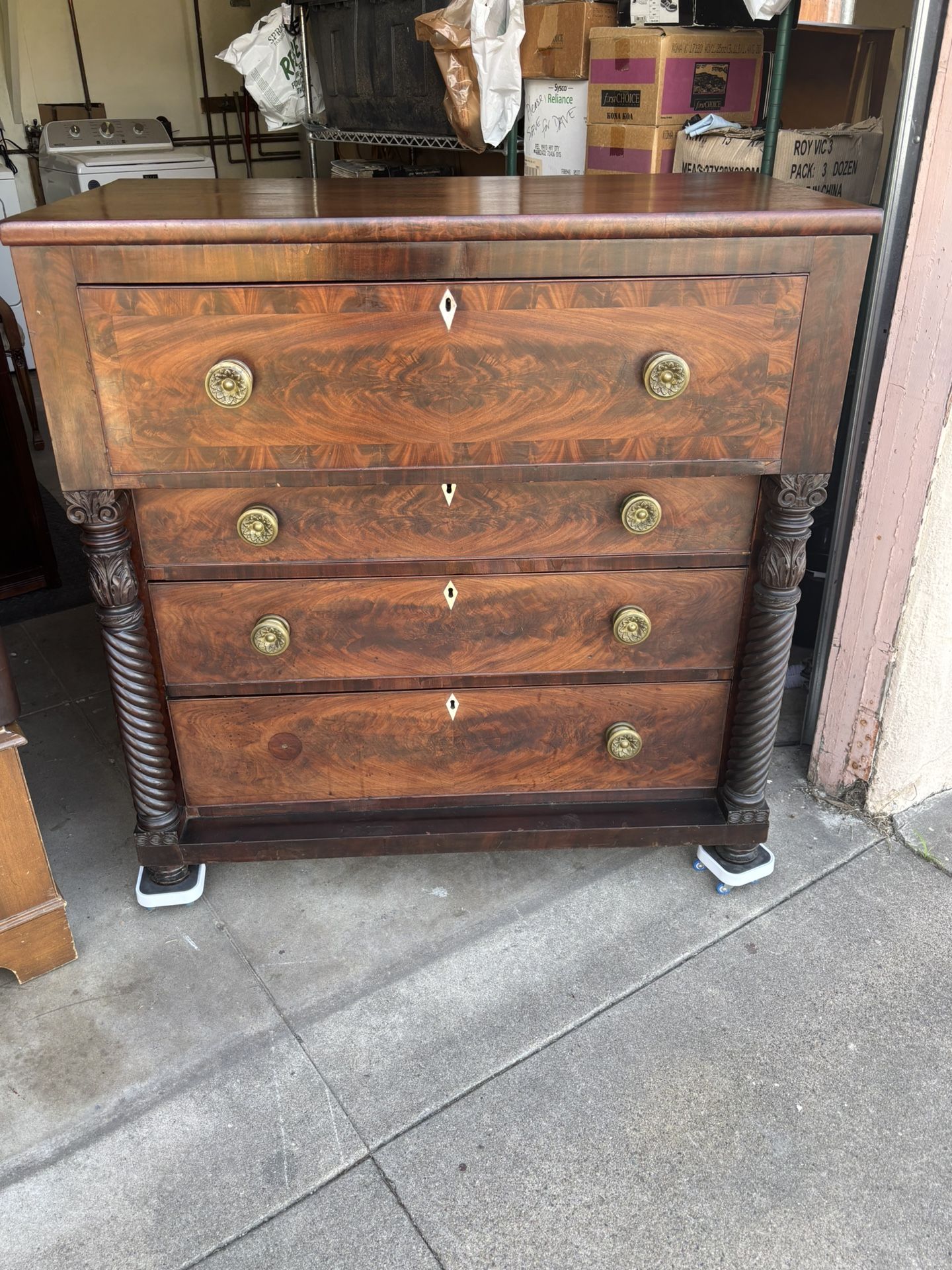 Empire-style mahogany butler's secretary desk with flame veneer.