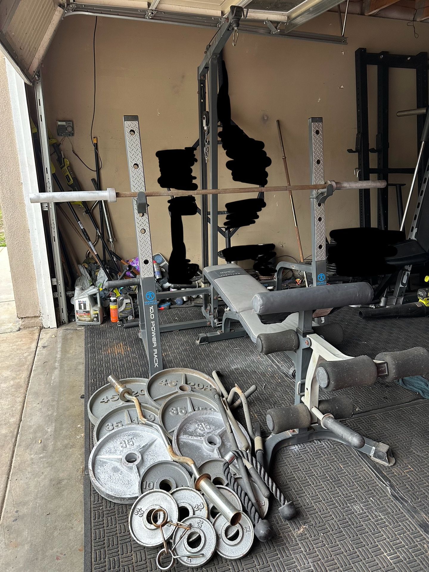 Bench press/squat rack with pulley system and 275lbs of Olympic weights plus curl bar
