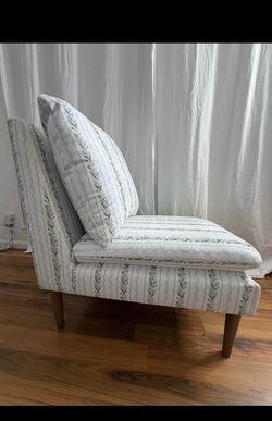 armless slipper chair upholstered in a classic "Grandmillennial" style floral stripe pattern