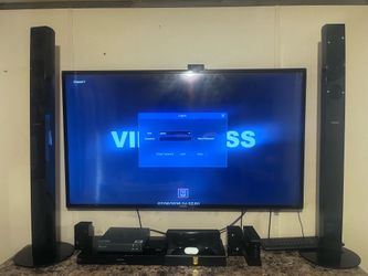 Samsung 60 inch smart hub TV and surround sound with 3-D Blu-ray player Panasonic