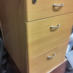 Wood three drawer file cabinets  1 maple 1 cherry also have 2 grey metal herman miller
Delivery may be possible 