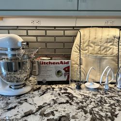 KitchenAid artisan stand mixer with five attachments and cover
