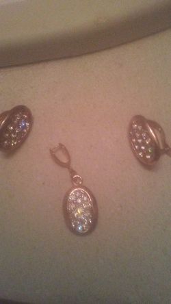 Jewelry; earrings and matching charm