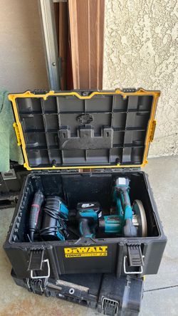 Dewalt tool box with Makita drills and charger and skill saw. 180