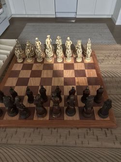 Multiple antique chess sets with Board