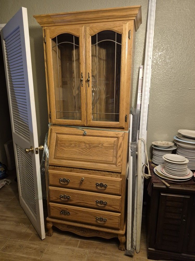 oak secretary desk with a hutch.