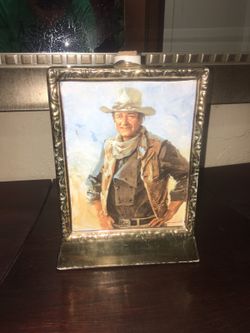 Empty Old antique John Wayne Whiskey Bottle covered in gold