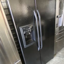 Great  ge refrigerator side by side   With ice maker and water dispenser