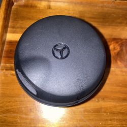 Mercedes-Benz OEM ashtray insert designed to fit in a vehicle's cup holder. 