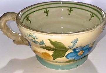 Hand-painted coffee mug by Tracy Porter. featuring yellow & blue floral prints