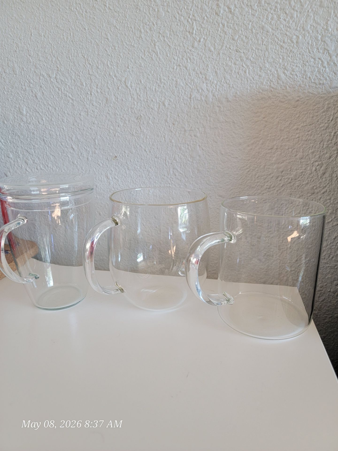 Clear glass coffee mugs.