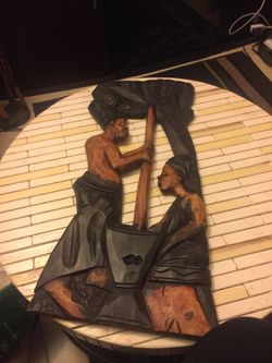 Hand sculpted Africans wall sculpt in mixed ebony and oak wood.