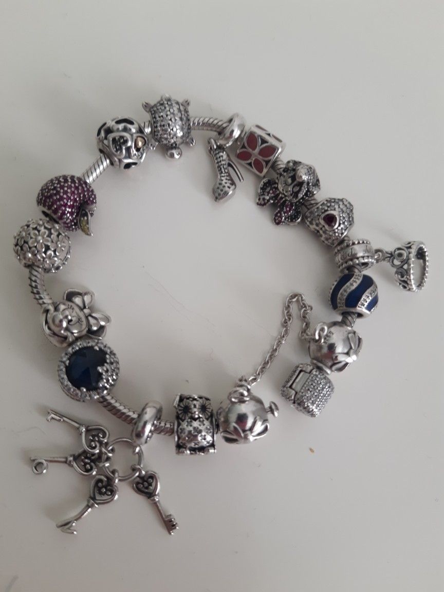 PANDORA BRACELET WITH 16 CHARMS $375 OR BO