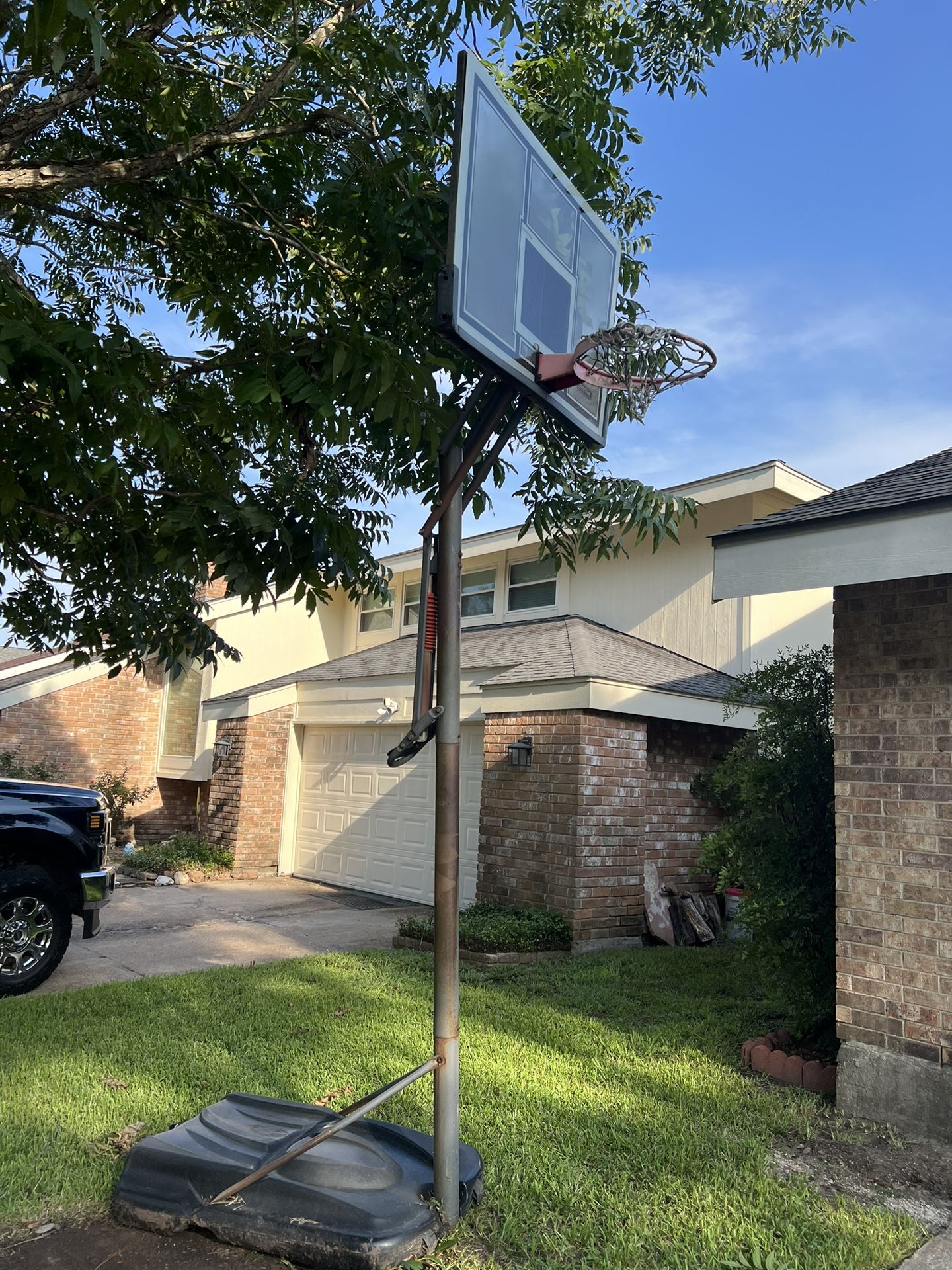 Lifetime 90734 Adjustable Portable Basketball Hoop, 54-Inch Tempered Glass Backboard, Black